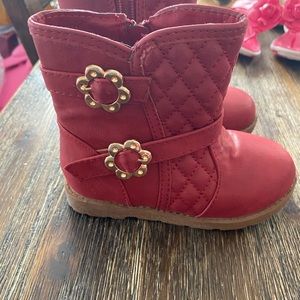 Red boots with flower embellishment